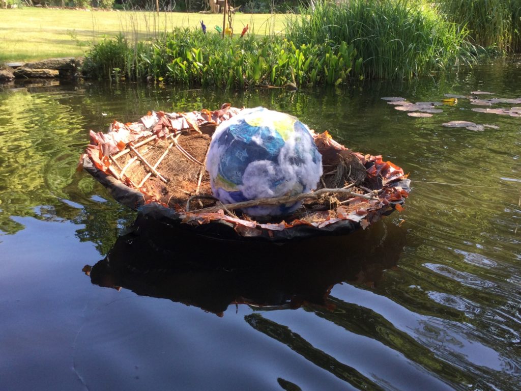 Bee Springwood coracle in sun lake